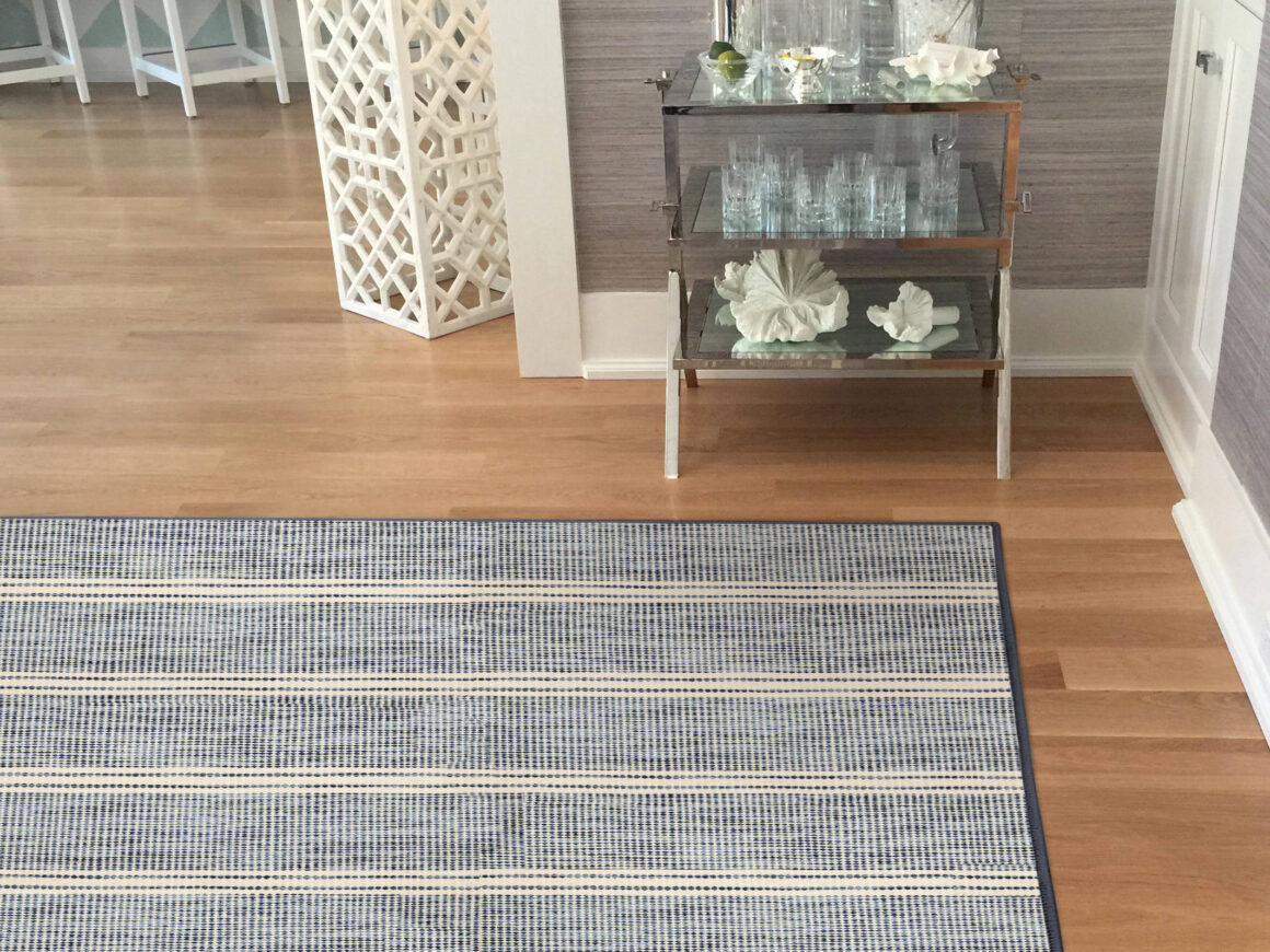 blue striped wool rug in a coastal styled home